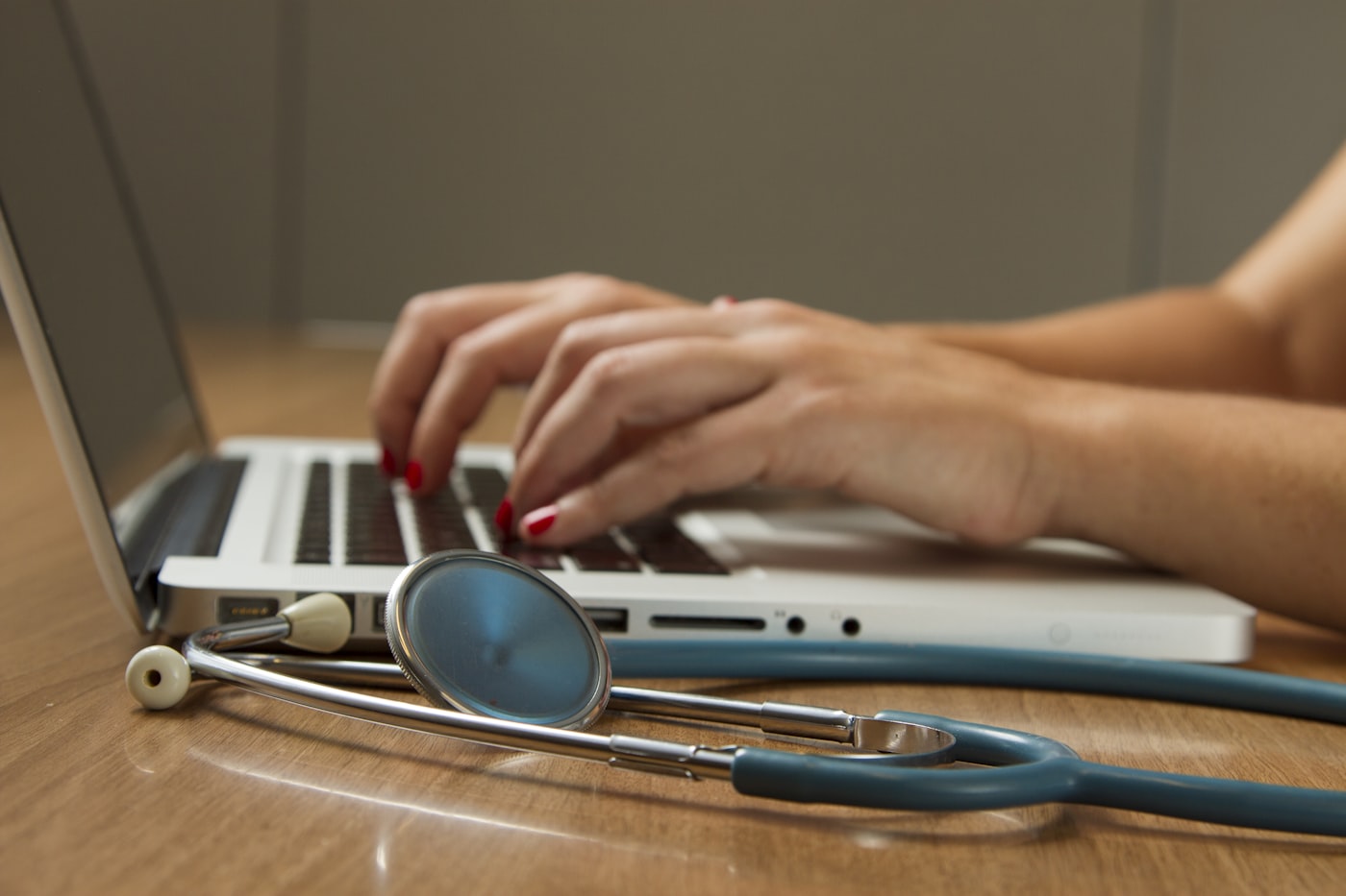 A stethoscope and medical documentation on a desk, representing independent evaluation and reporting.