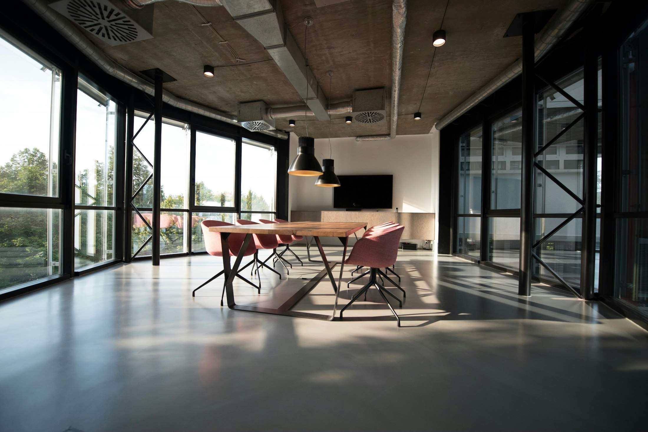 A quiet professional conference room prepared for case discussion and expert consultation.
